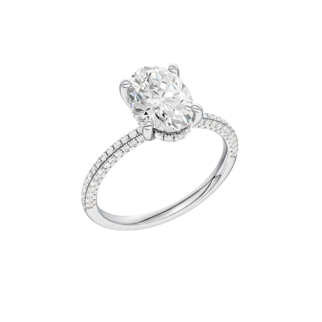 A three-quarter view of the Oval cut diamond engagement ring in 14k white gold with a pavé diamond band and cathedral setting