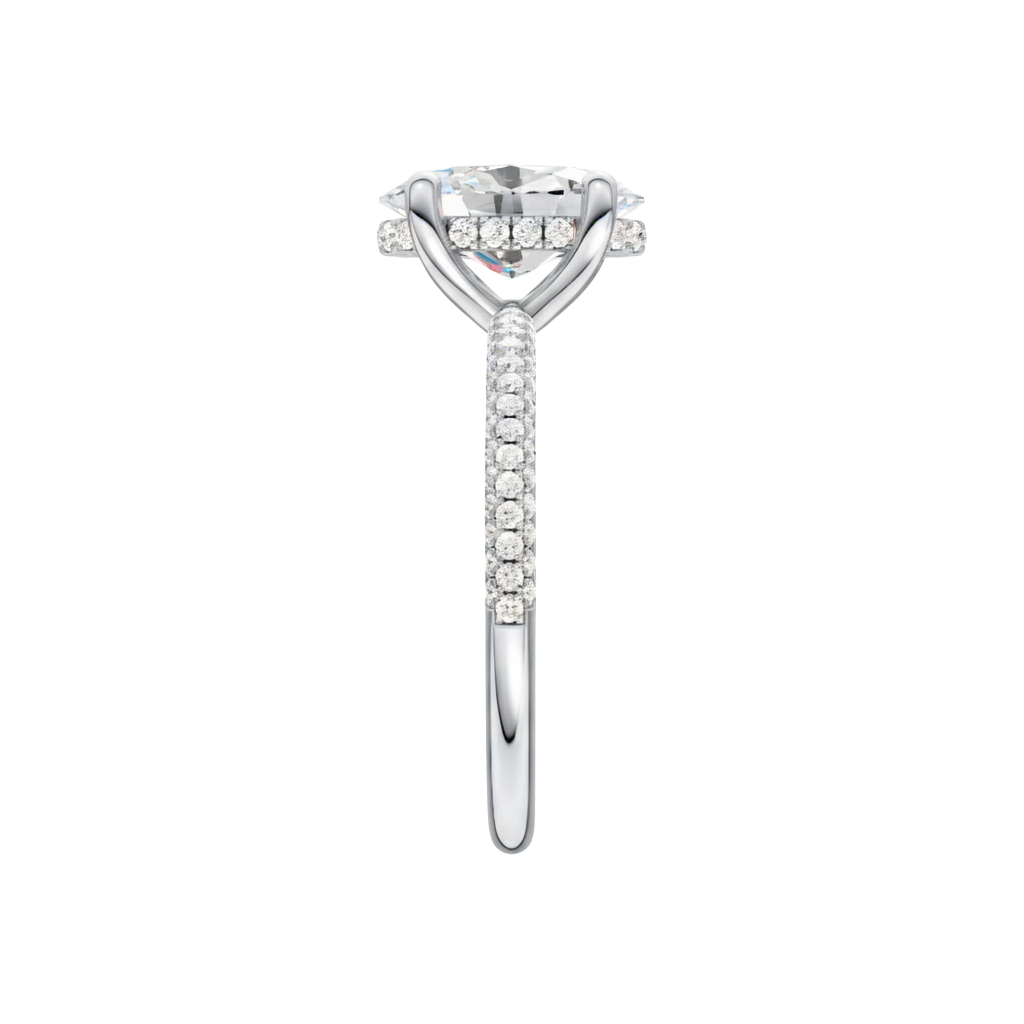 A side view of the Oval cut diamond engagement ring in platinum with a pavé diamond band and cathedral setting