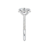 A side view of the Oval cut diamond engagement ring in 14k white gold with a pavé diamond band and cathedral setting