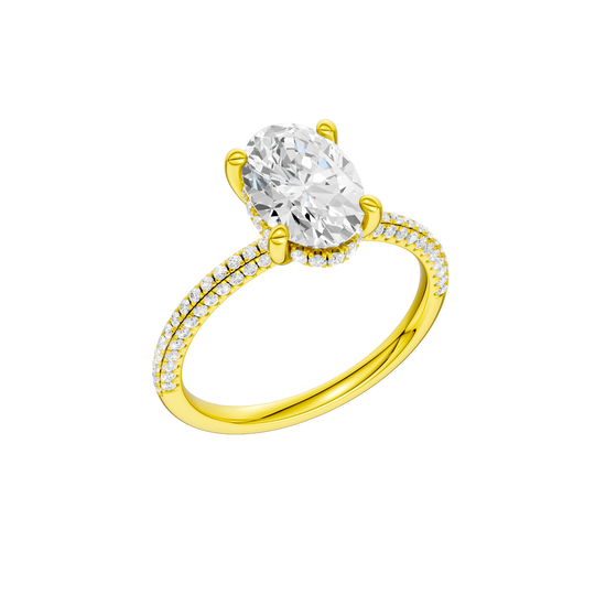 A three-quarter view of the Oval cut diamond engagement ring in 14k yellow gold with a pavé diamond band and cathedral setting