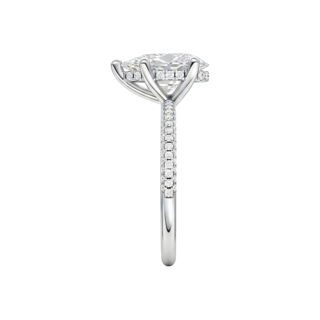 A side view of the Pear cut diamond engagement ring in platinum with a pavé diamond band and cathedral setting