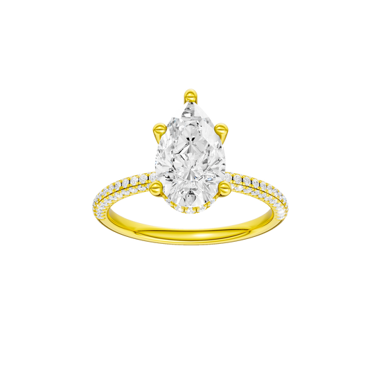 A front view of the Pear cut diamond engagement ring in 14k yellow gold with a pavé diamond band and cathedral setting