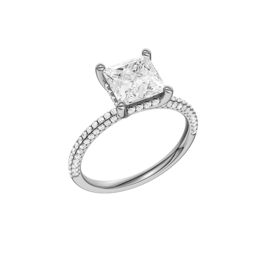 A three-quarter view of the Princess cut diamond engagement ring in platinum with a pavé diamond band and cathedral setting