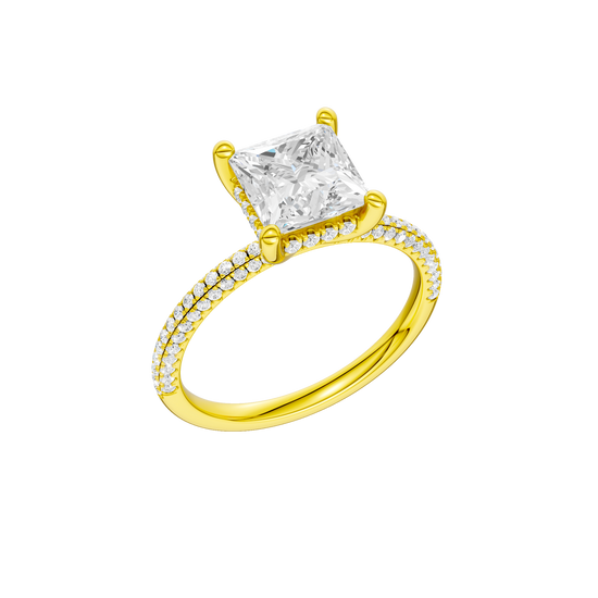A three-quarter view of the Princess cut diamond engagement ring in 14k yellow gold with a pavé diamond band and cathedral setting