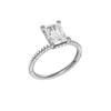 A three-quarter view of the Radiant cut diamond engagement ring in 14k white gold with a pavé diamond band and cathedral setting