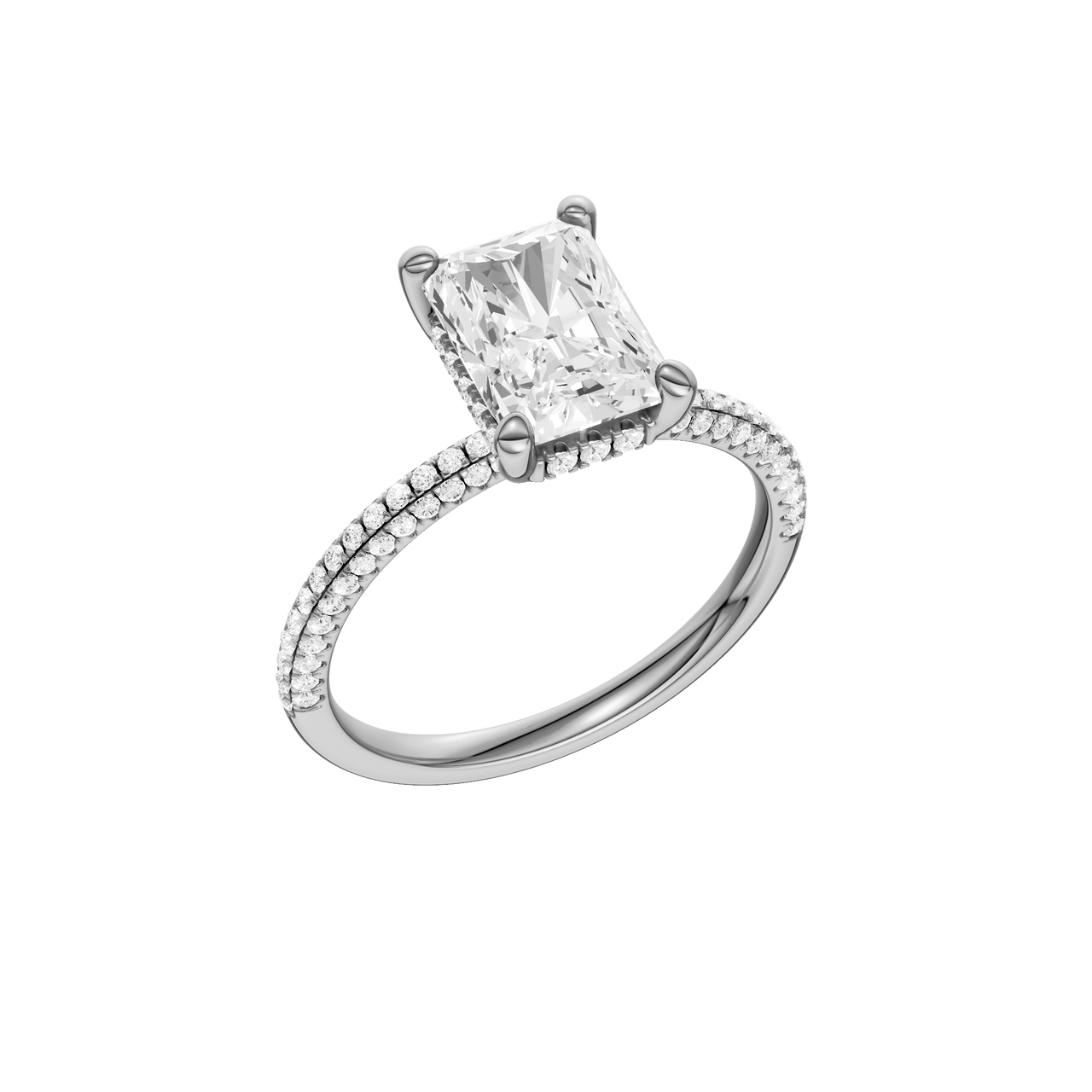A three-quarter view of the Radiant cut diamond engagement ring in 14k white gold with a pavé diamond band and cathedral setting