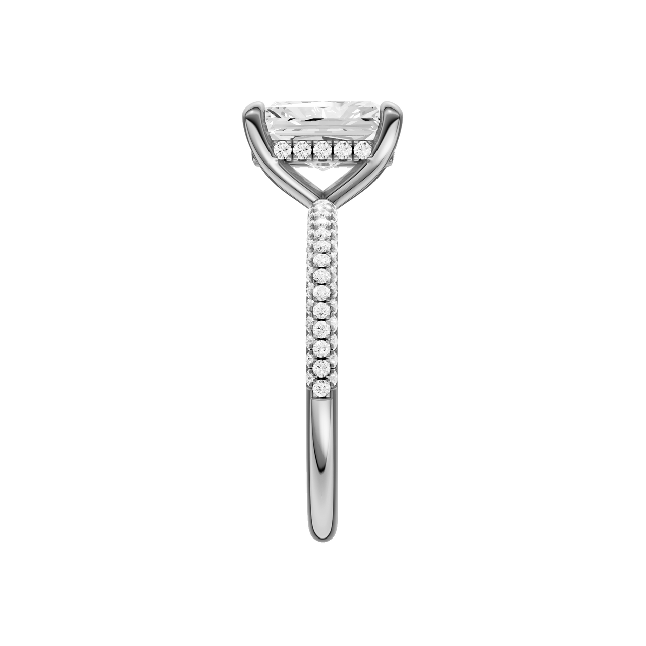 A side view of the Radiant cut diamond engagement ring in 14k white gold with a pavé diamond band and cathedral setting