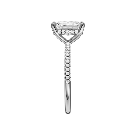 A side view of the Radiant cut diamond engagement ring in platinum with a pavé diamond band and cathedral setting