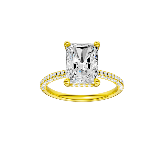 A front view of the Radiant cut diamond engagement ring in 14k yellow gold with a pavé diamond band and cathedral setting