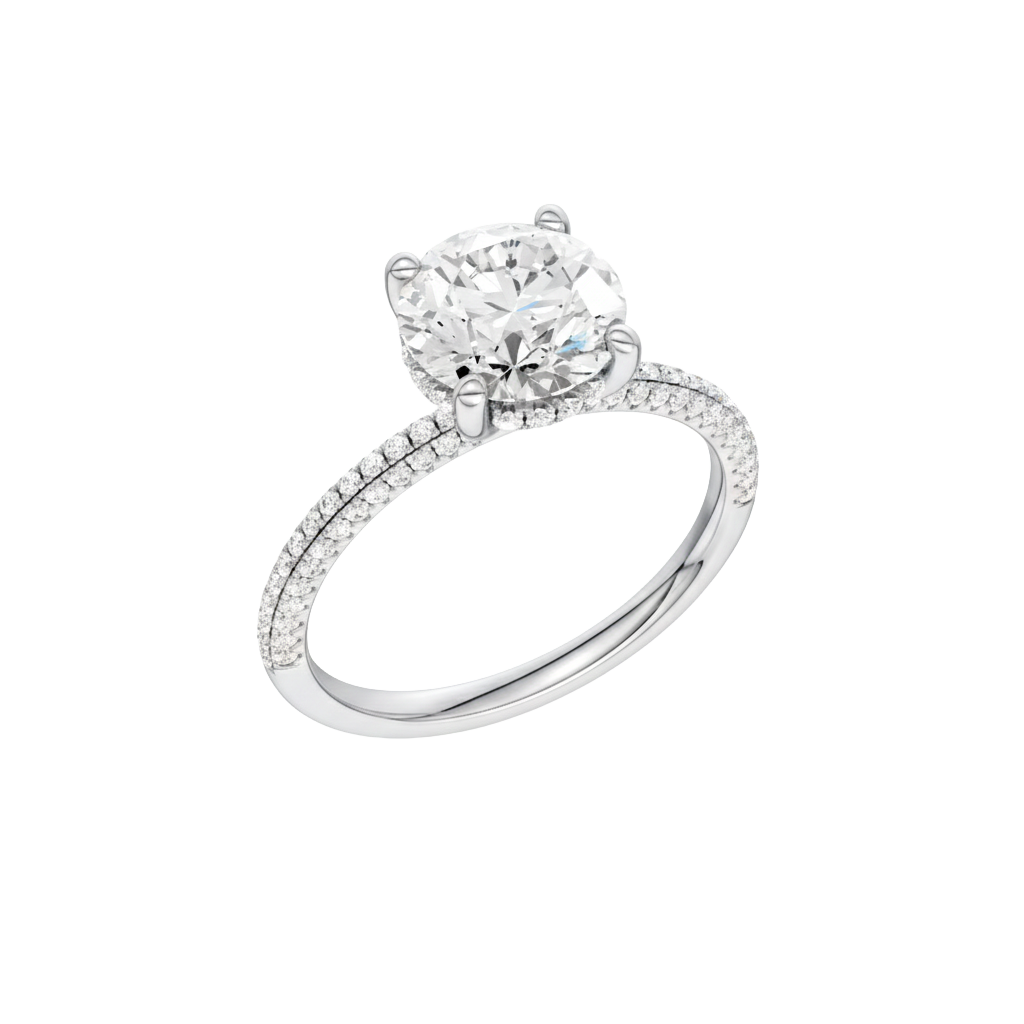 A three-quarter view of the Round cut diamond engagement ring in 14k white gold with a pavé diamond band and cathedral setting