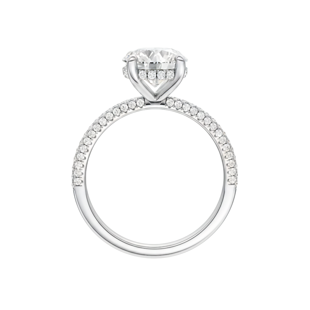 A profile view of the Round cut diamond engagement ring in 14k white gold with a pavé diamond band and cathedral setting