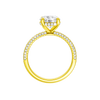 A profile view of the Round cut diamond engagement ring in 14k yellow gold with a pavé diamond band and cathedral setting