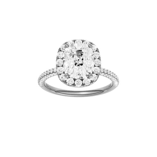 A front view of the Elongated cushion cut diamond engagement ring in platinum with a pavé diamond band and solitaire setting
