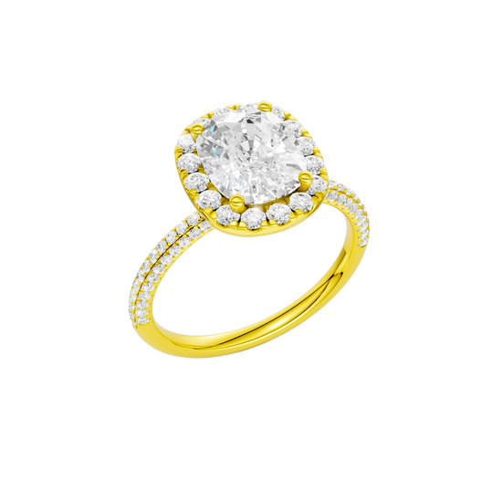 A three-quarter view of the Elongated cushion cut diamond engagement ring in 14k yellow gold with a pavé diamond band and solitaire setting