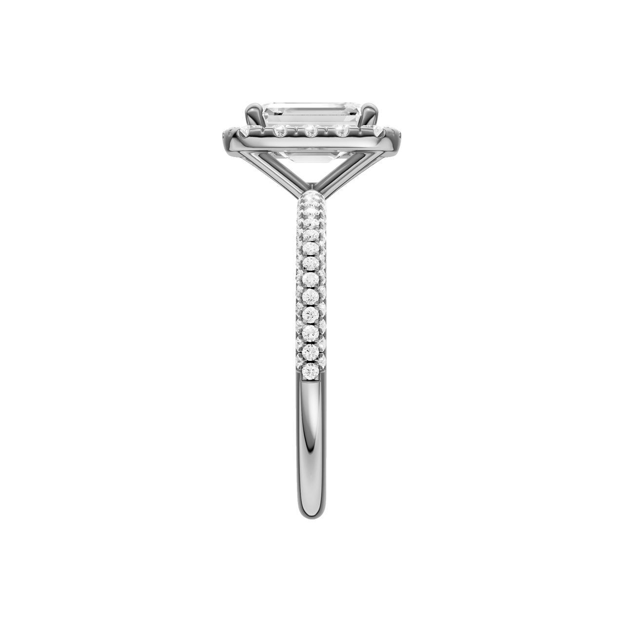 A side view of the Emerald cut diamond engagement ring in 14k white gold with a pavé diamond band and solitaire setting