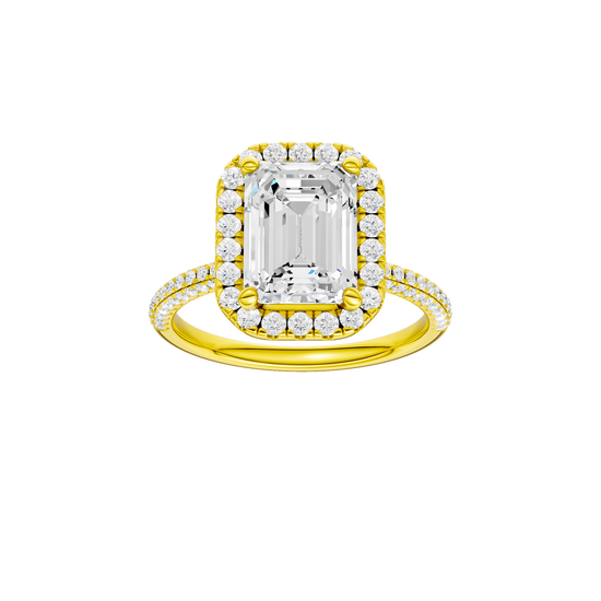 A front view of the Emerald cut diamond engagement ring in 14k yellow gold with a pavé diamond band and solitaire setting