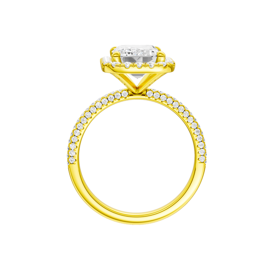 A profile view of the Emerald cut diamond engagement ring in 14k yellow gold with a pavé diamond band and solitaire setting