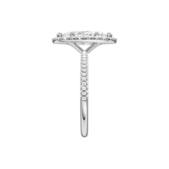 A side view of the Marquise cut diamond engagement ring in 14k white gold with a pavé diamond band and solitaire setting