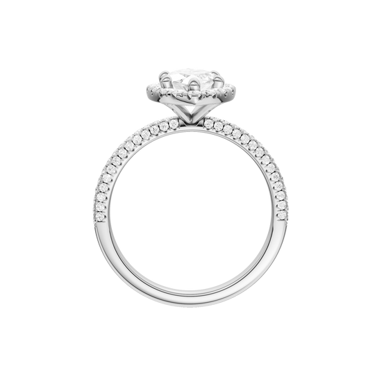 A profile view of the Marquise cut diamond engagement ring in 14k white gold with a pavé diamond band and solitaire setting