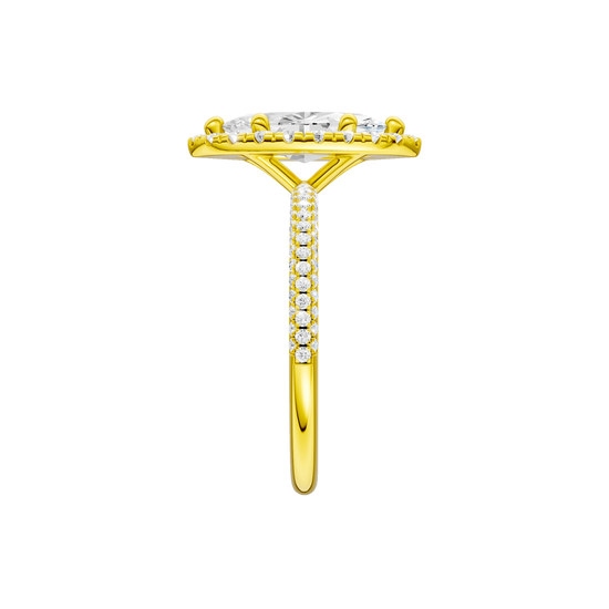 A side view of the Marquise cut diamond engagement ring in 14k yellow gold with a pavé diamond band and solitaire setting