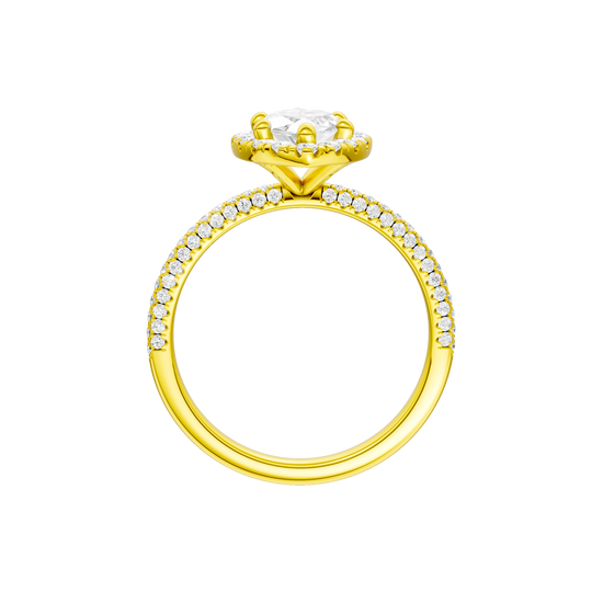 A profile view of the Marquise cut diamond engagement ring in 14k yellow gold with a pavé diamond band and solitaire setting