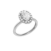 A three-quarter view of the oval cut diamond engagement ring in 14k white gold with a pavé diamond band and solitaire setting