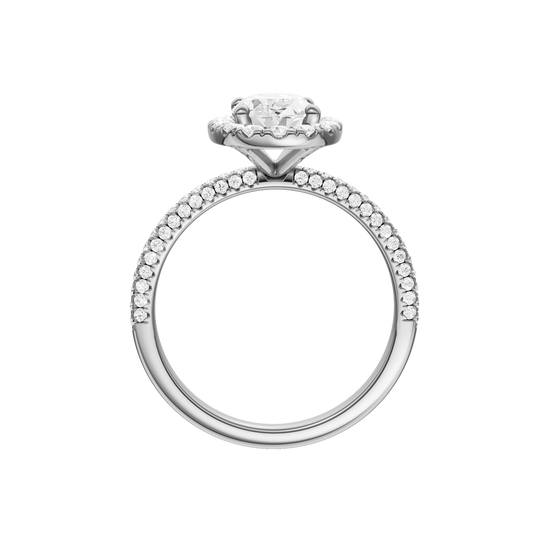 A profile  view of the oval cut diamond engagement ring in 14k white gold with a pavé diamond band and solitaire setting