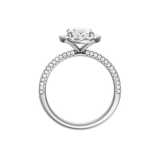 A profile  view of the oval cut diamond engagement ring in platinum with a pavé diamond band and solitaire setting