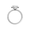 A profile  view of the oval cut diamond engagement ring in platinum with a pavé diamond band and solitaire setting