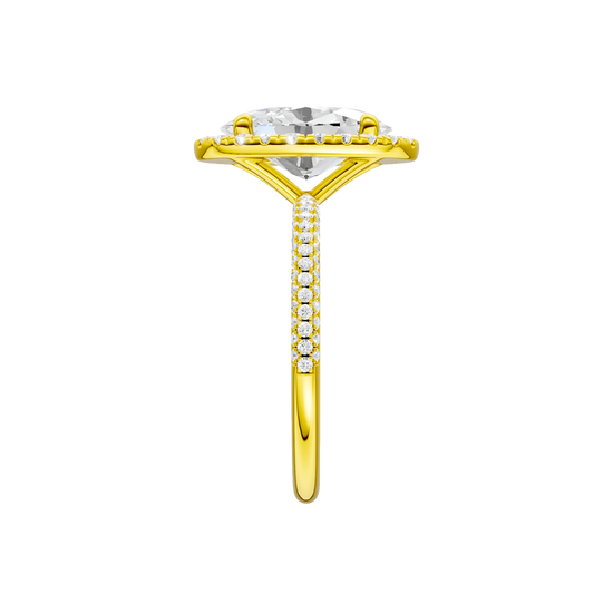 A side view of the oval cut diamond engagement ring in 14k yellow gold with a pavé diamond band and solitaire setting