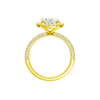 A profile  view of the oval cut diamond engagement ring in 14k yellow gold with a pavé diamond band and solitaire setting