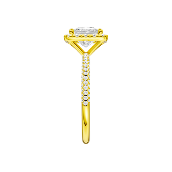 A side view of the Princess cut diamond engagement ring in 14k yellow gold with a pavé diamond band and solitaire setting