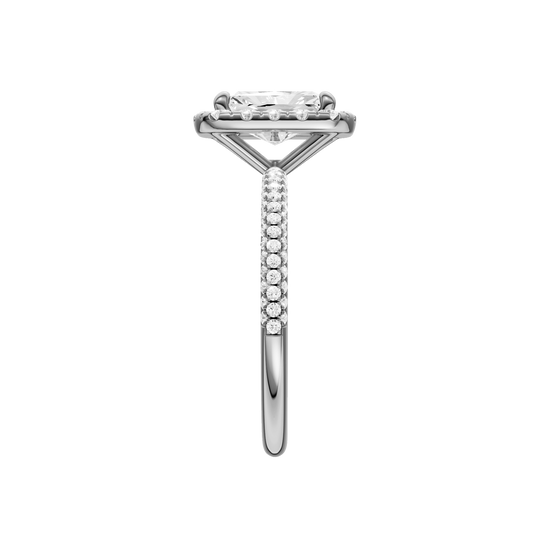 A side view of the Radiant cut diamond engagement ring in 14k white gold with a pavé diamond band and solitaire setting