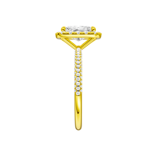 A side view of the Radiant cut diamond engagement ring in 14k yellow gold with a pavé diamond band and solitaire setting