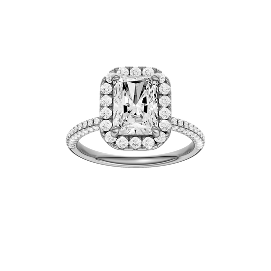 A front view of the Radiant cut diamond engagement ring in platinum with a pavé diamond band and solitaire setting