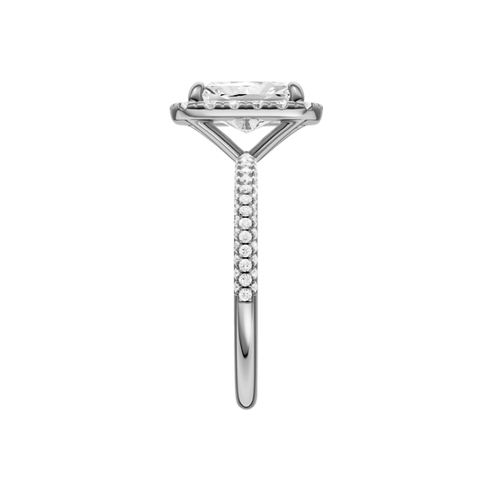 A side view of the Radiant cut diamond engagement ring in platinum with a pavé diamond band and solitaire setting