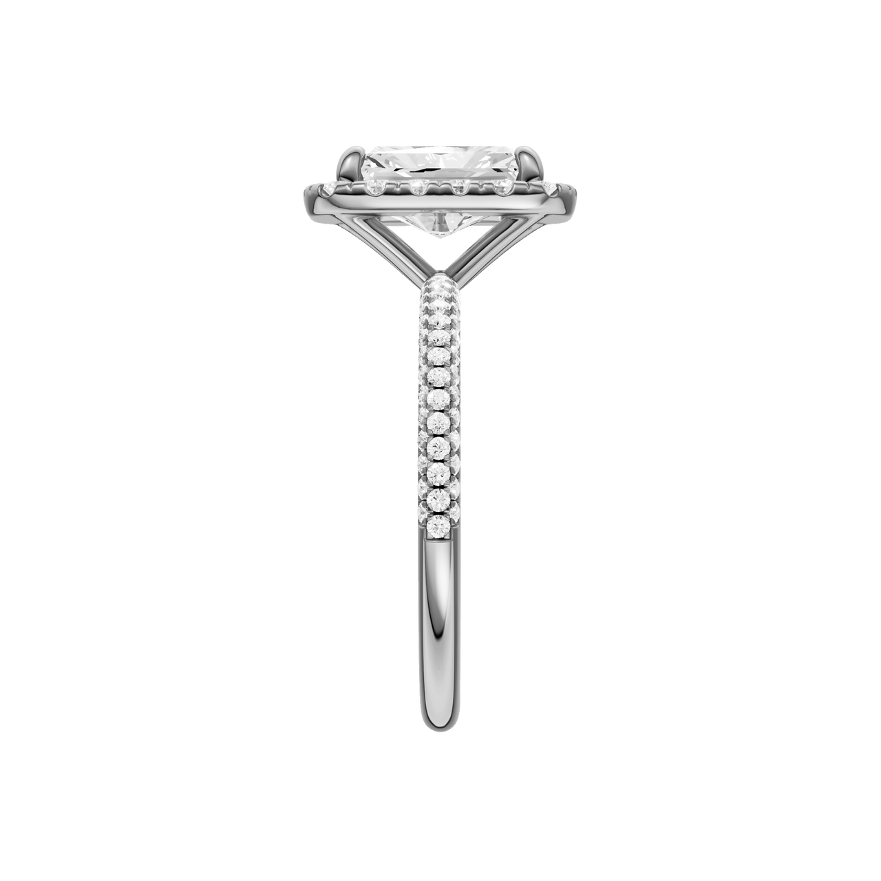 A side view of the Radiant cut diamond engagement ring in platinum with a pavé diamond band and solitaire setting