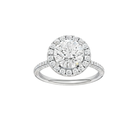 A front view of the Round cut diamond engagement ring in 14k white gold with a pavé diamond band and solitaire setting