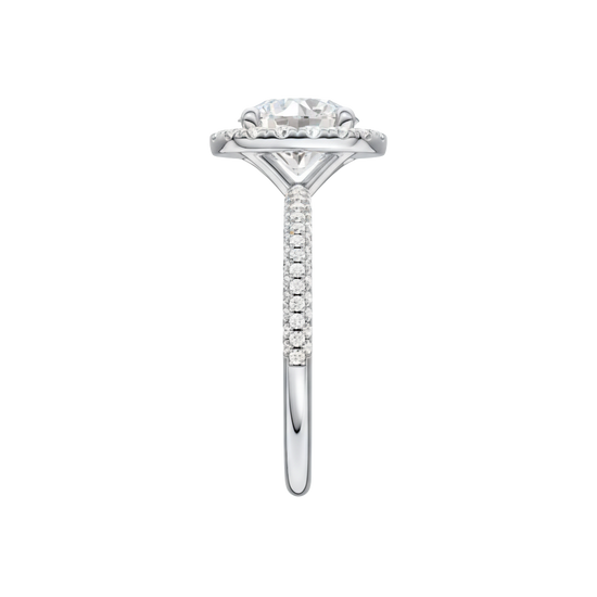 A side view of the Round cut diamond engagement ring in platinum with a pavé diamond band and solitaire setting