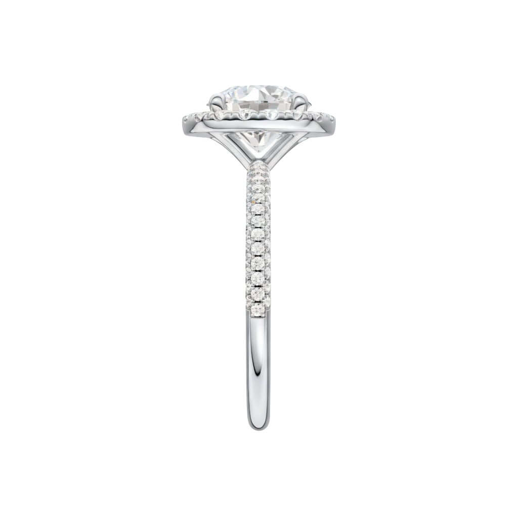 A side view of the Round cut diamond engagement ring in 14k white gold with a pavé diamond band and solitaire setting