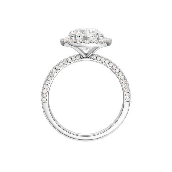 A profile view of the Round cut diamond engagement ring in platinum with a pavé diamond band and solitaire setting