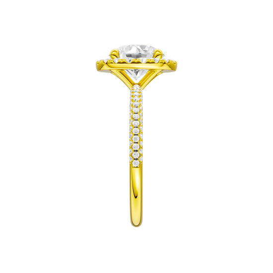 A side view of the Round cut diamond engagement ring in 14k yellow gold with a pavé diamond band and solitaire setting