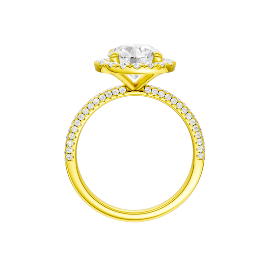 A profile view of the Round cut diamond engagement ring in 14k yellow gold with a pavé diamond band and solitaire setting