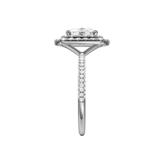 A side view of the Elongated cushion cut diamond engagement ring in platinum with a pavé diamond band and solitaire setting