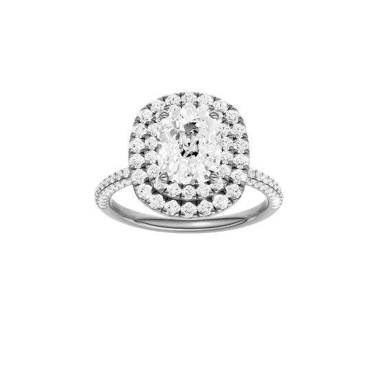 A front view of the Elongated cushion cut diamond engagement ring in 14k white gold with a pavé diamond band and solitaire setting