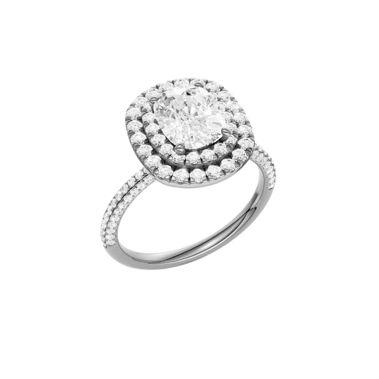 A three-quarter view of the Elongated cushion cut diamond engagement ring in platinum with a pavé diamond band and solitaire setting