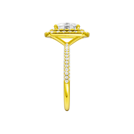 A side view of the Elongated cushion cut diamond engagement ring in 14k yellow gold with a pavé diamond band and solitaire setting