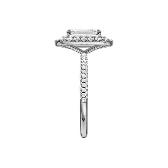 A side view of the Emerald cut diamond engagement ring in 14k white gold with a pavé diamond band and solitaire setting