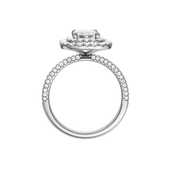 A profile view of the Emerald cut diamond engagement ring in 14k white gold with a pavé diamond band and solitaire setting