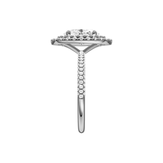 A side view of the Oval cut diamond engagement ring in 14k white gold with a pavé diamond band and solitaire setting